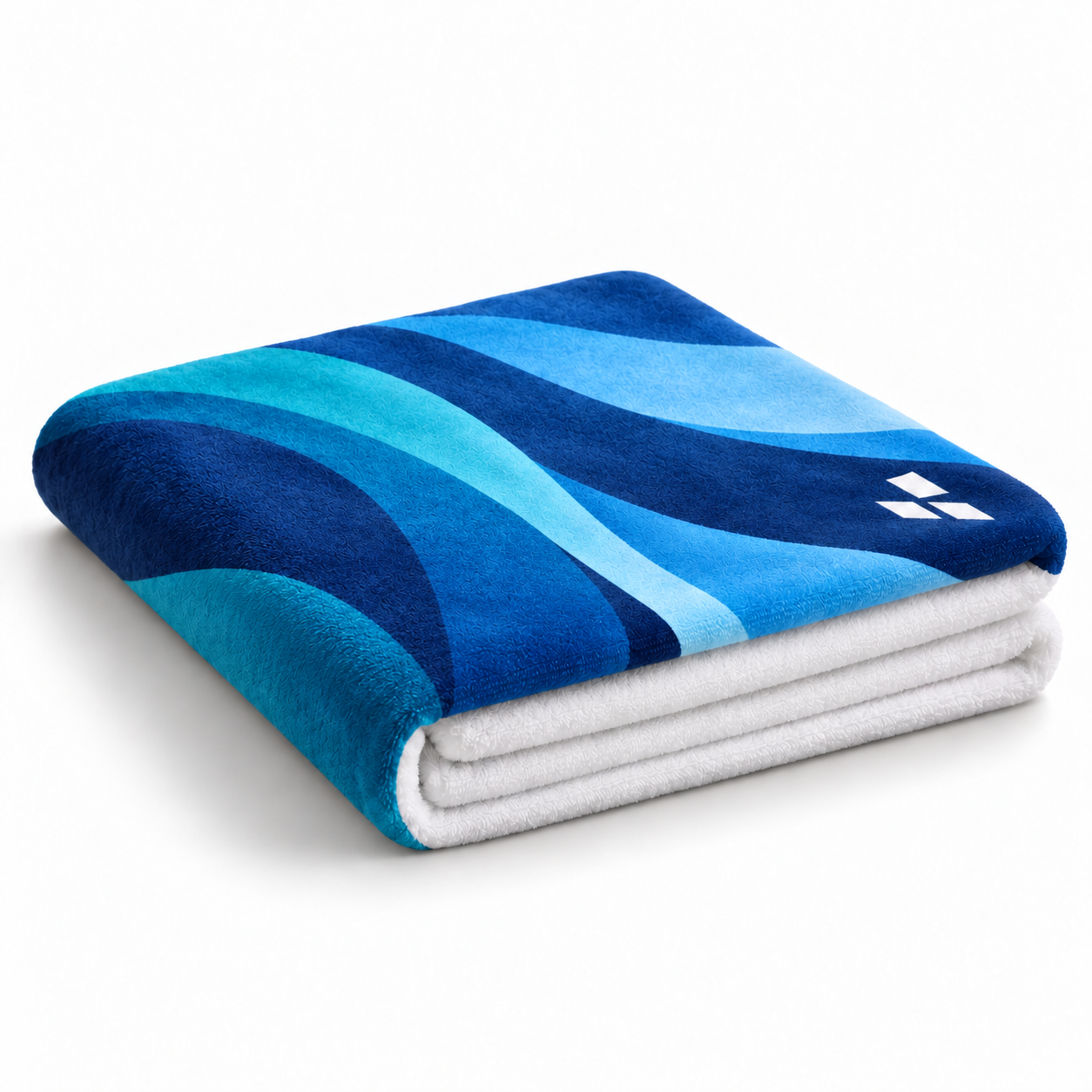 Representative printed towel after washing, with the same navy and teal design and lifted plush fibres.